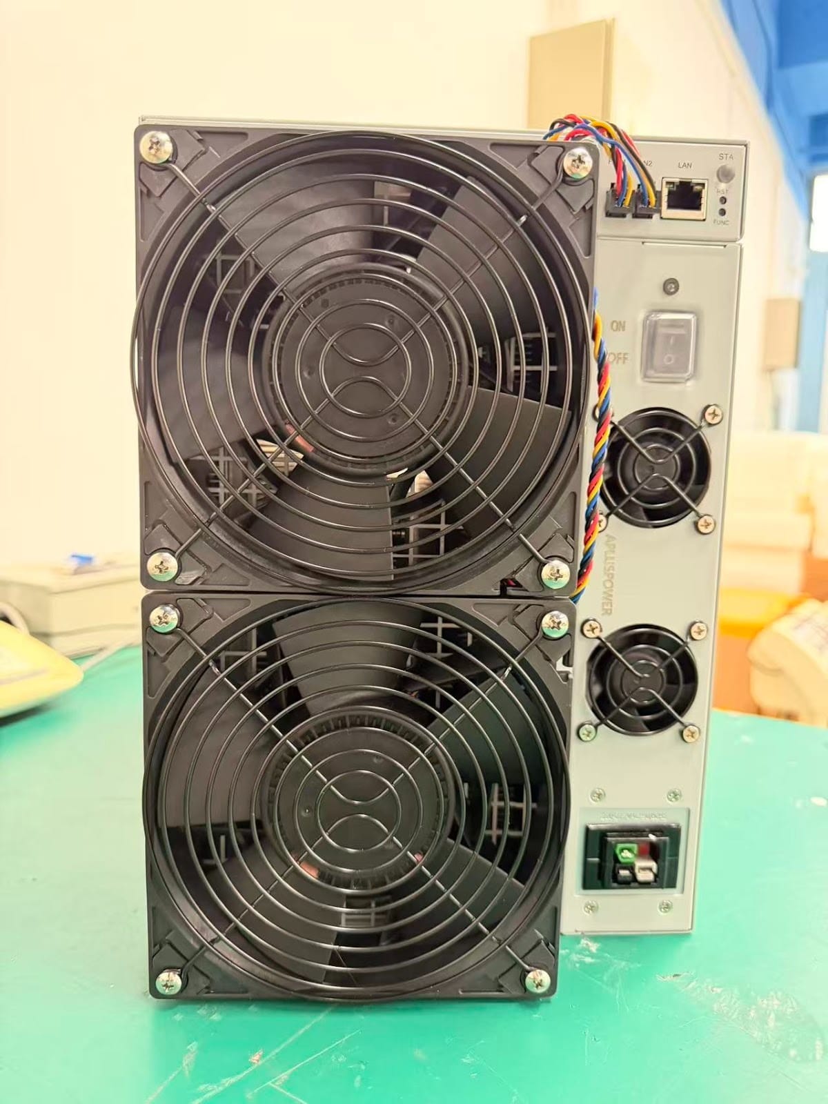 Front view of Canaan A16 ASIC miner showing dual high-performance cooling fans and power supply unit