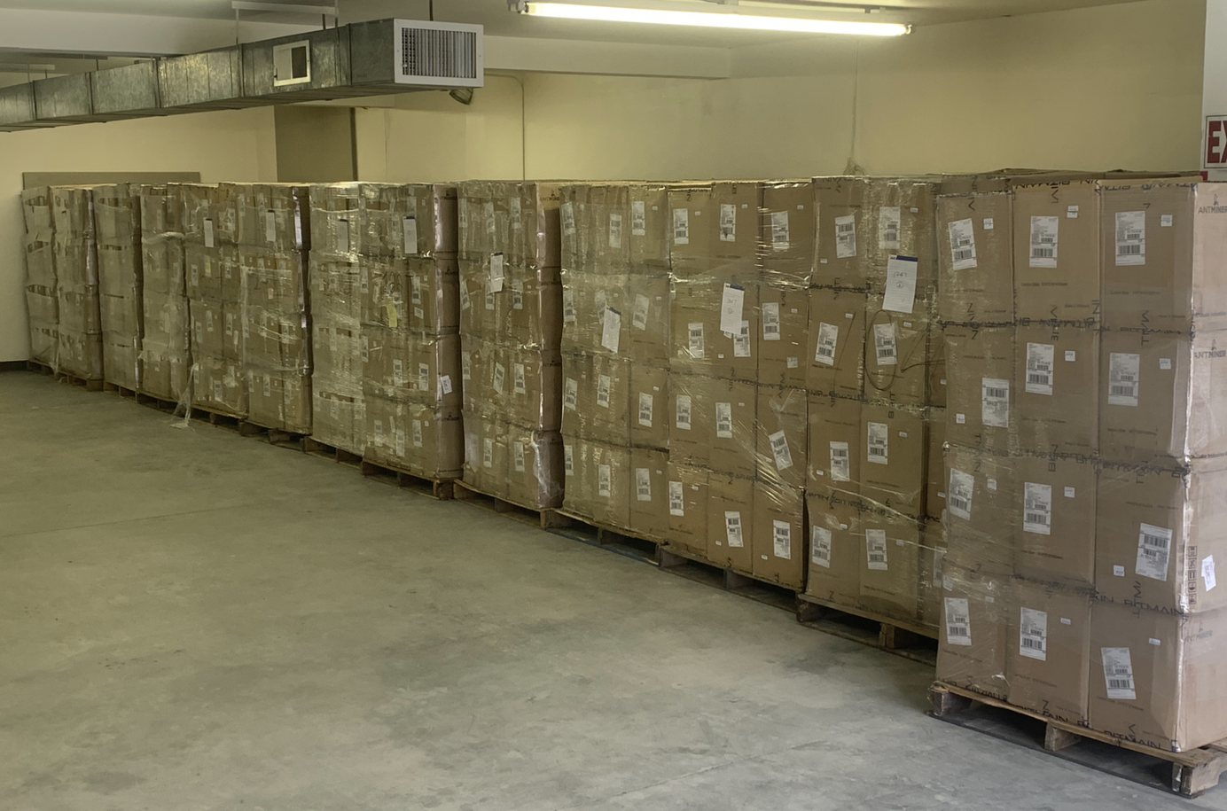 Bitcoin mining ASICs in packaging, waiting to be shipped to miners 