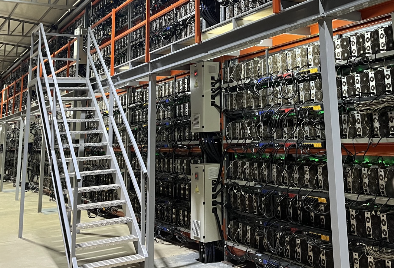 Racks of Bitcoin mining ASICs at a Bitcoin mining facility 