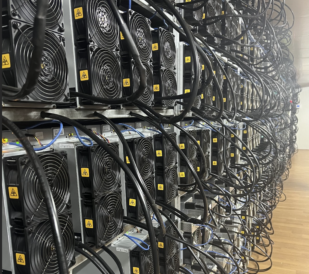 Racks of Bitcoin mining ASICs