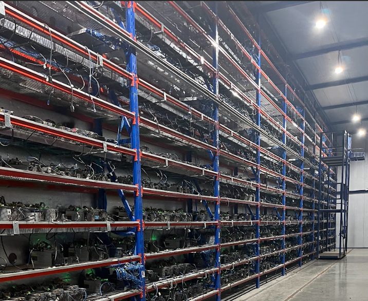 Bitcoin mining ASICs hashing on racks in a mining farm