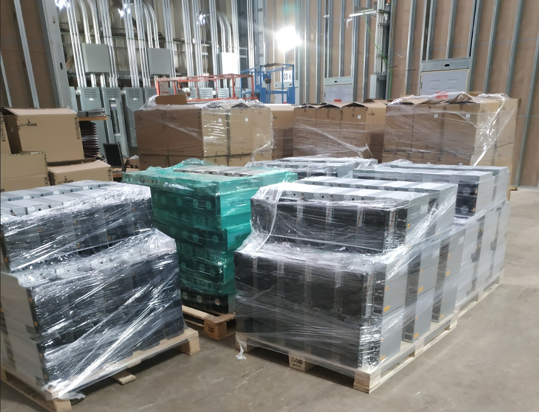 Shipments of Antminer S19 and Whatminer M30 model Bitcoin mining ASICs waiting to be unpacked