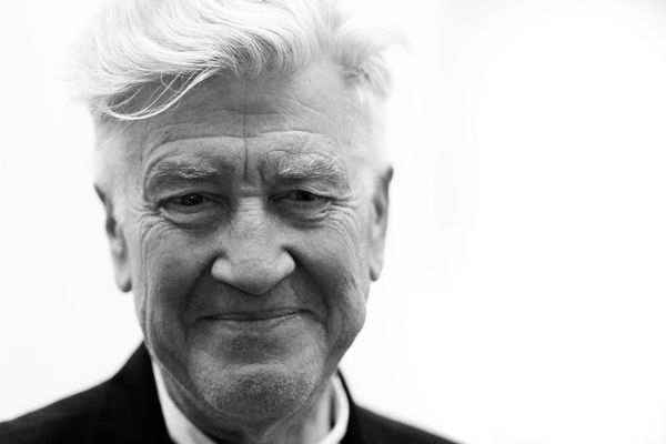 Featured image: David Lynch smiling in black and white photo (2014) by Alessandro via Flickr.