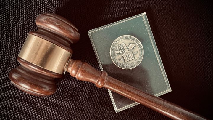 gavel and Woodbridge coin