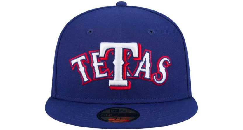 A blue and red baseball cap for the Texas Rangers that reads "TeTas" instead of Texas.