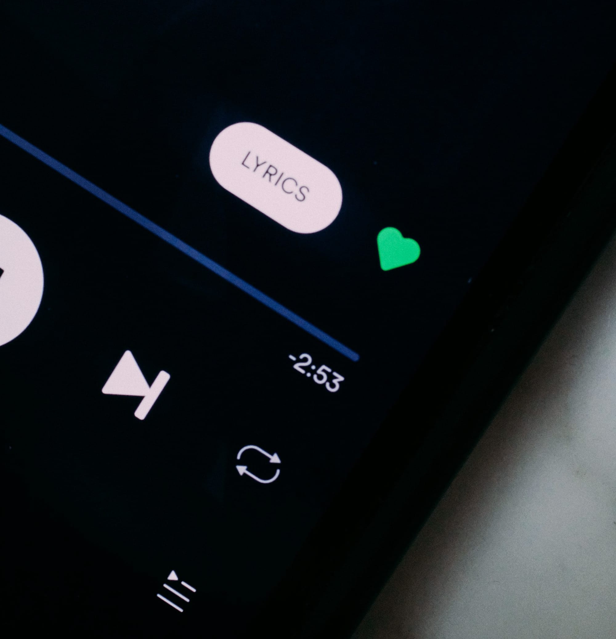 black remote control on white textile