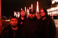 Irish Metalcore band Broken Habit Press Photo - all members standing on a city street under red lighting