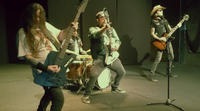 Scandinavian Jawbreakers band holding guitars and dancing to new song “She Was Mine”