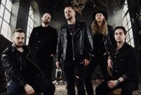 Blessed Insanity Band Photo- 4 members standing in a dark, dramatic abandoned church room