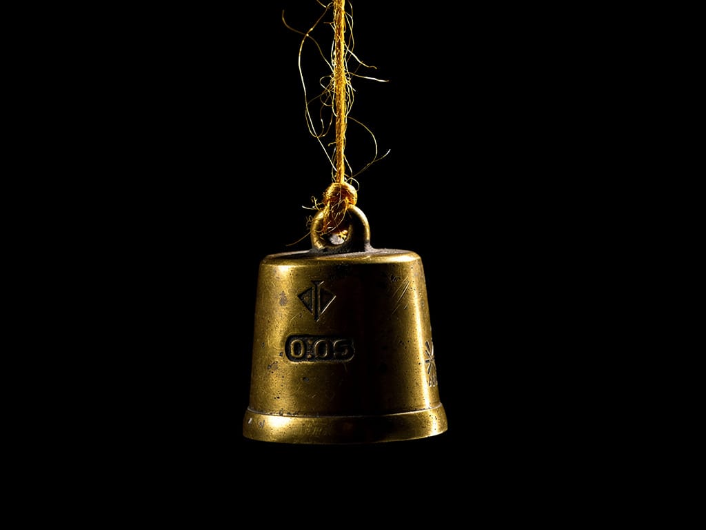 A single thread holding a heavy weight, symbolizing financial risk.