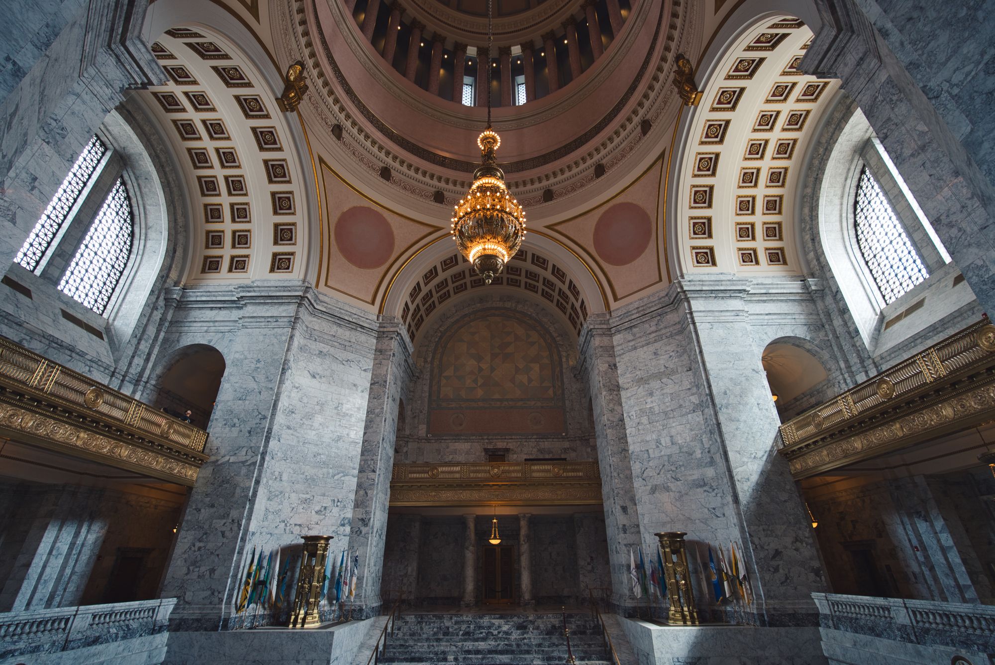 The Washington Capitol Building rotunda, made of marble and alabaster with a chandelier.