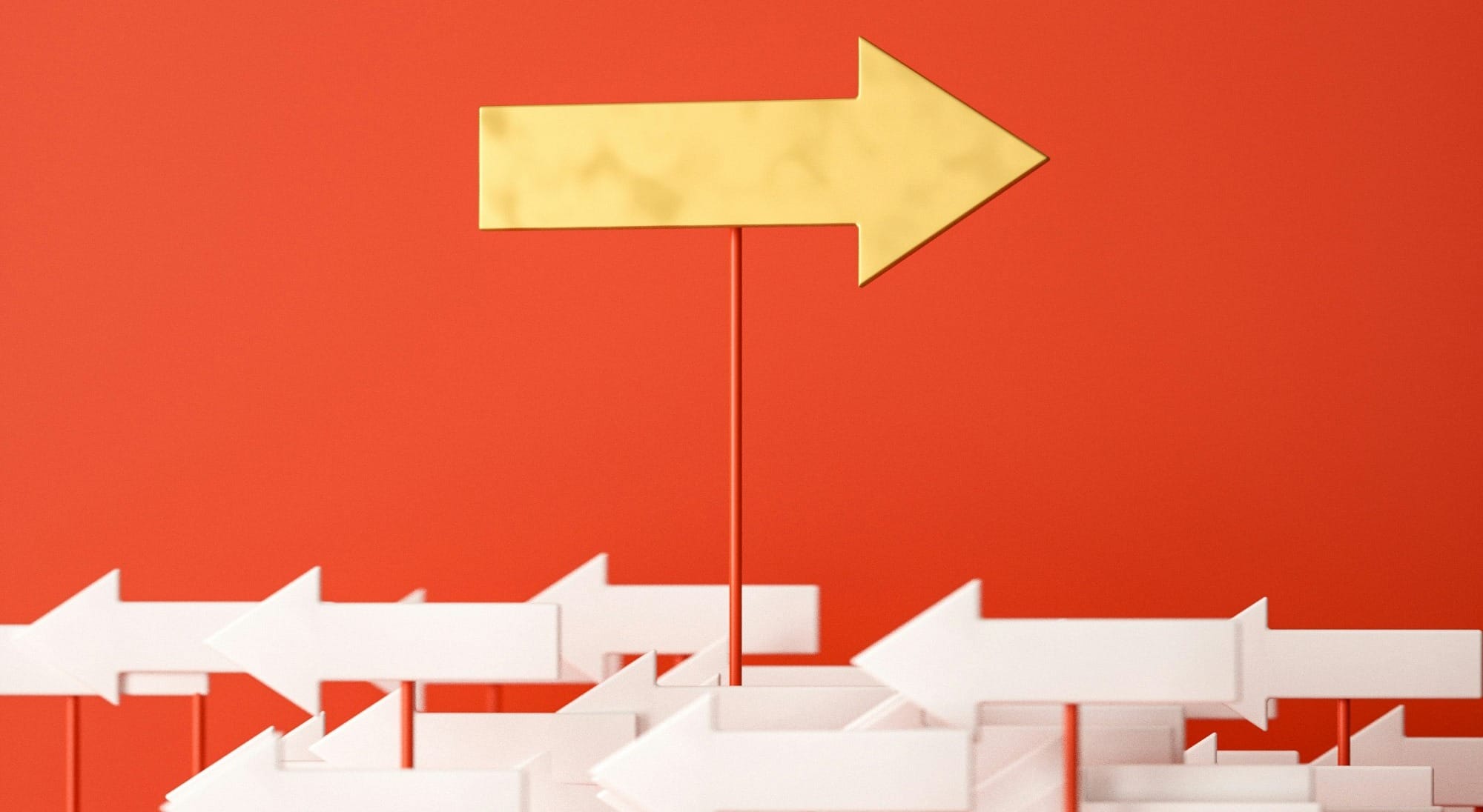 a red wall with a yellow arrow pointing in opposite directions
