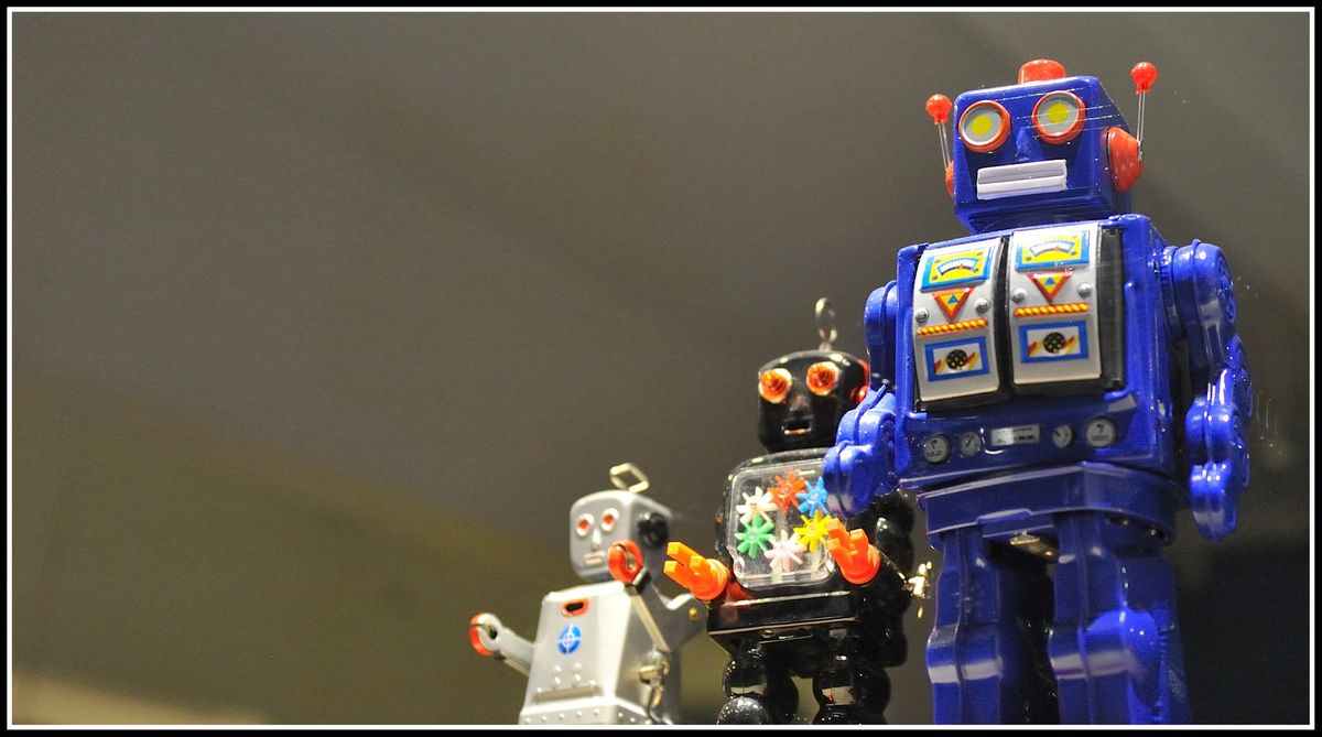 3 toy robots standing in a line