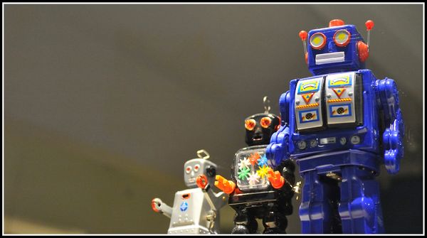 3 toy robots standing in a line