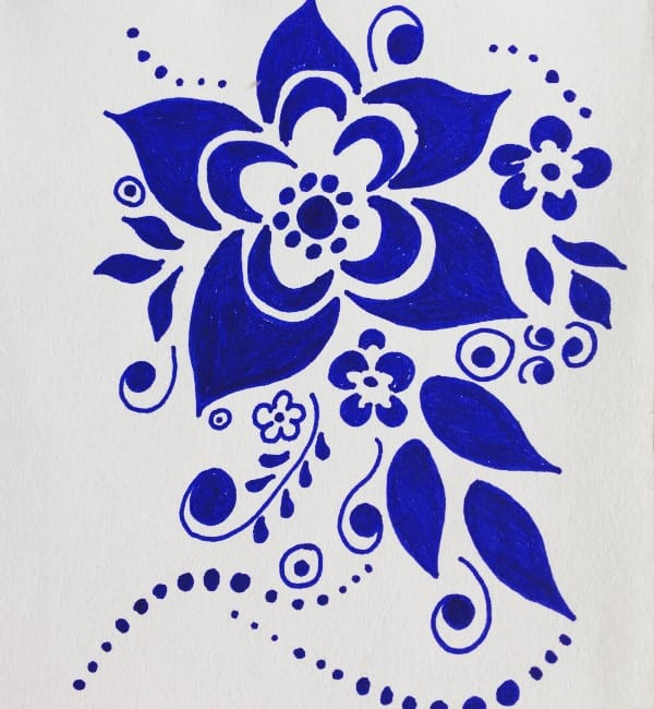 A hand-drawn illustration in dark blue ink on white paper: a large stylized flower surrounded by leaves, smaller blossoms, dots and curling swirls.
