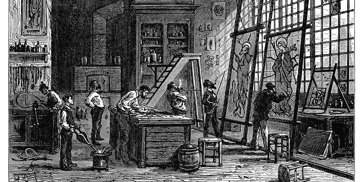Craftsmen inspect and admire the labors of delicate stained glass painters.