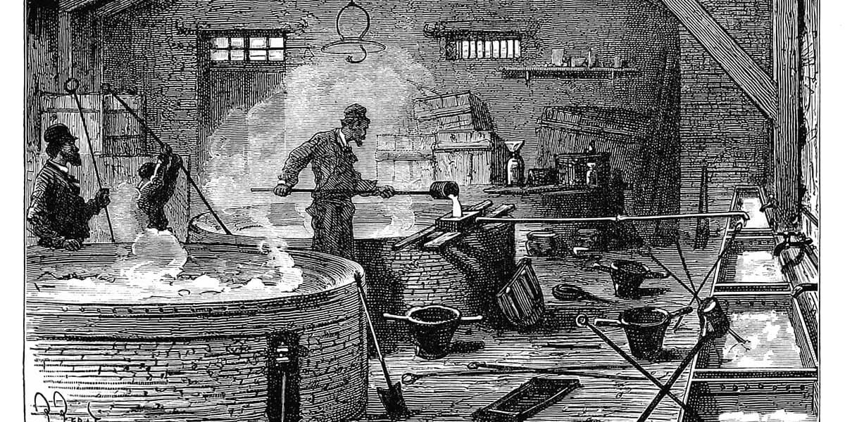 Men work over vats and machinery pouring and forming materials.