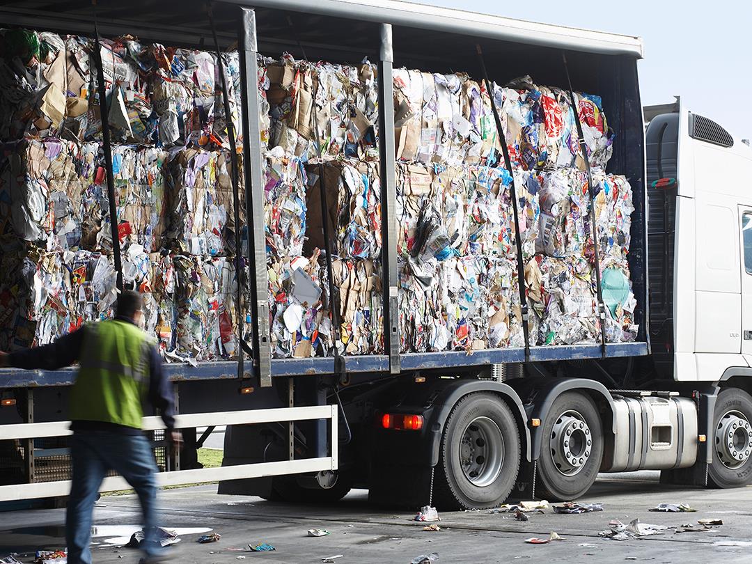 A lorry loaded with bales of recycled paper