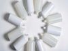 A series of plastic bottles, all without lids, have been sorted into a circular formation with their necks facing inwards.…