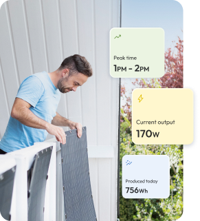 Mann der Solarpanel an der Außenfassade anbringt.png