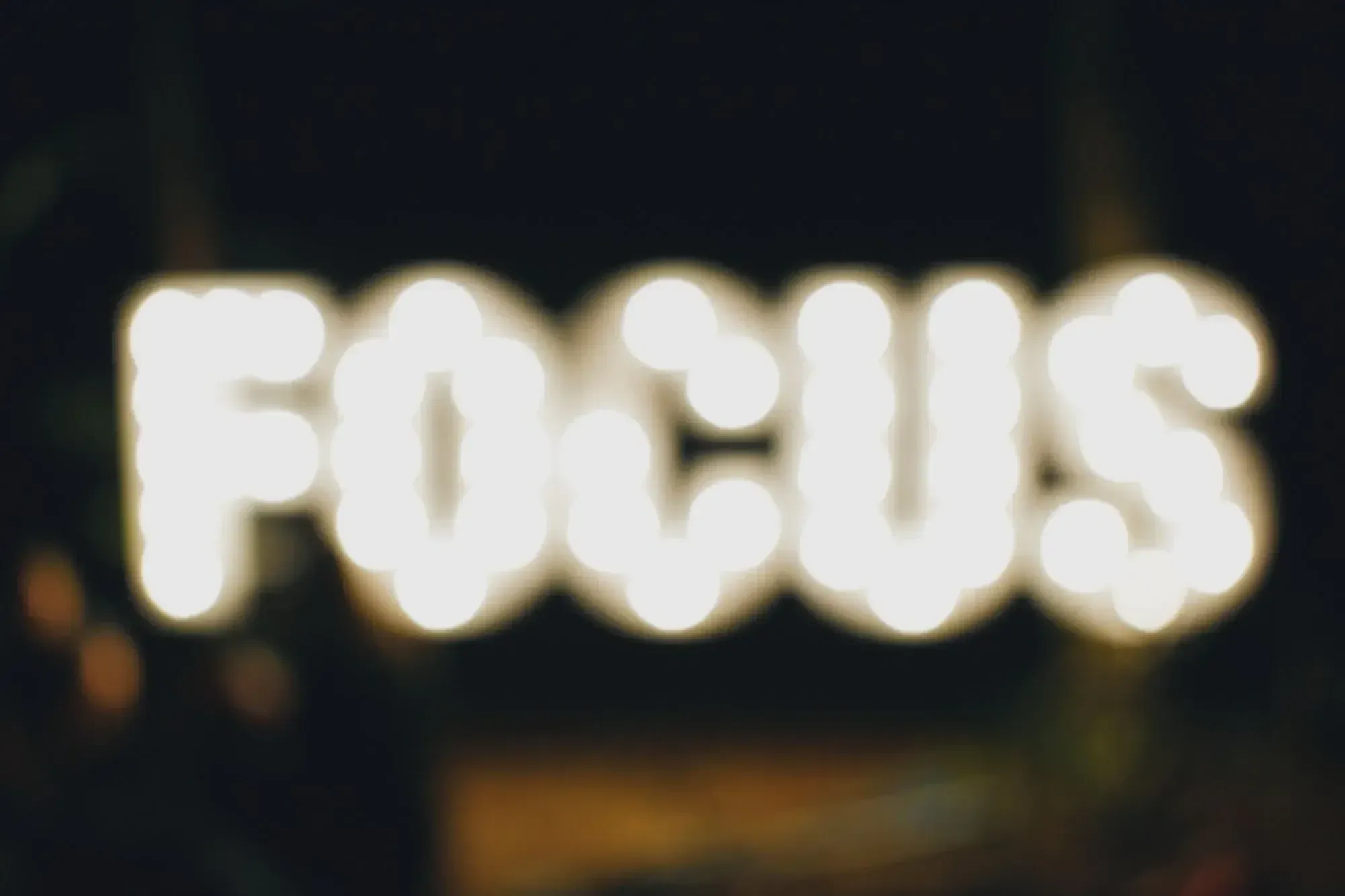 a LED lettering spelling FOCUS, but its blurred