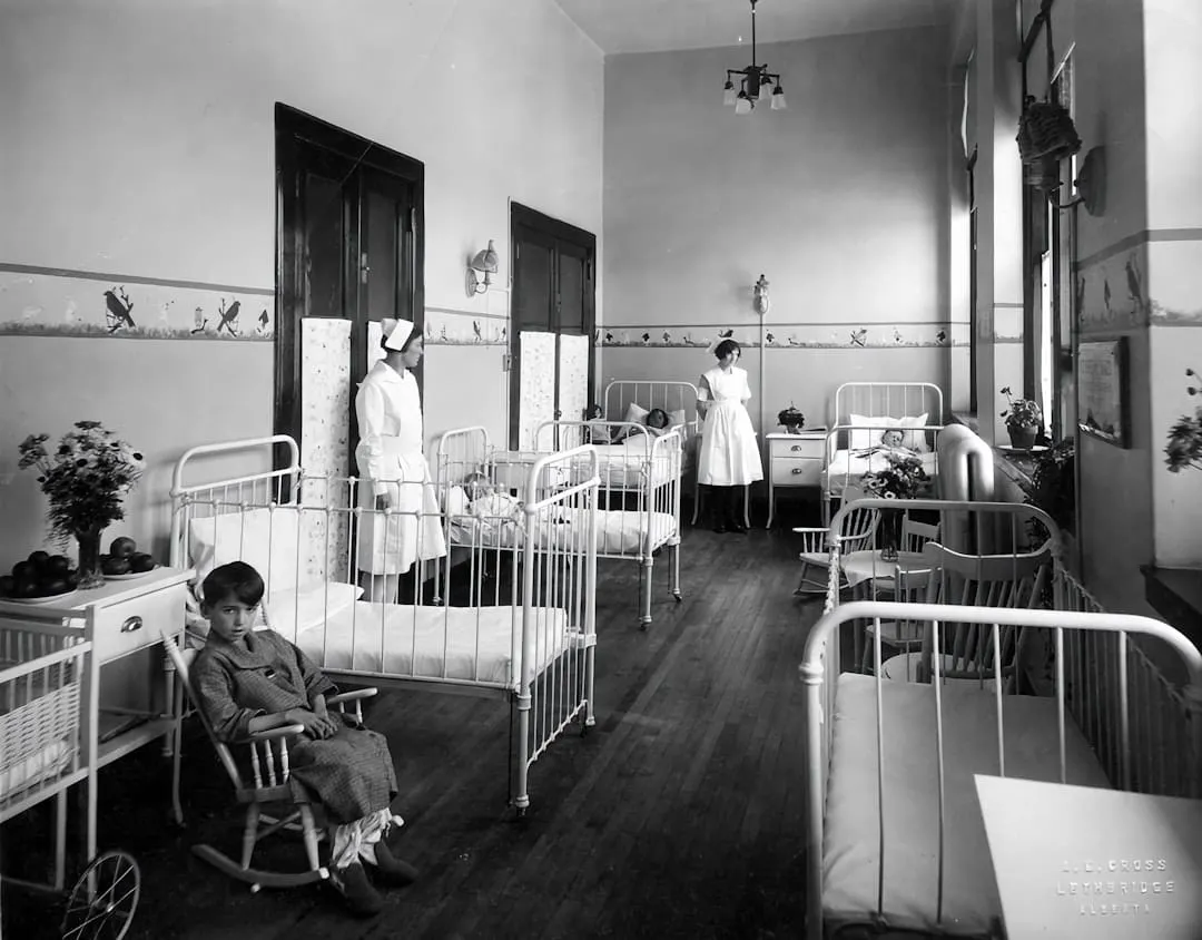 A UK nurse on ward — NMC revalidation requires 450 practice hours and 35 hours of CPD every three years.