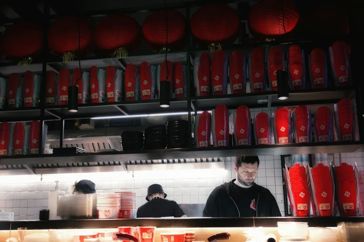 A commercial kitchen, UK food businesses must keep documented food safety and allergen records.