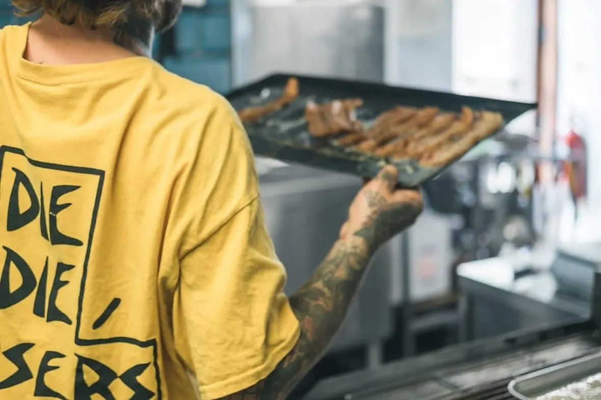 A chef working in a commercial kitchen, HACCP records are the UK food business compliance foundation.