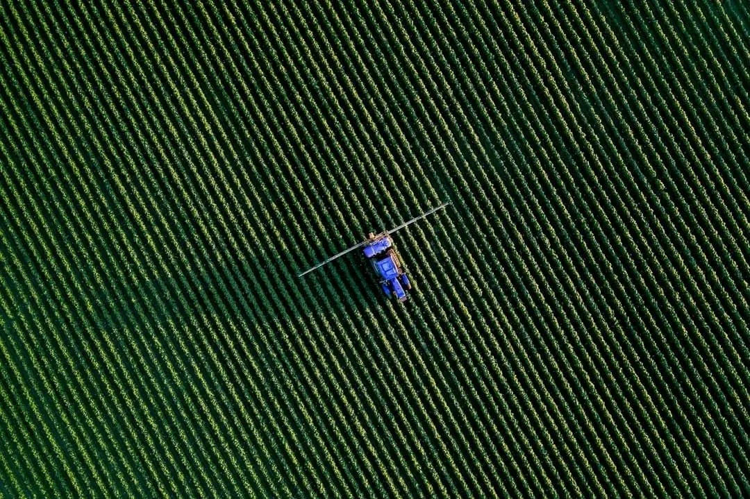 A UK farm crop sprayer — every professional pesticide application must be recorded with product, dose, date and operator.