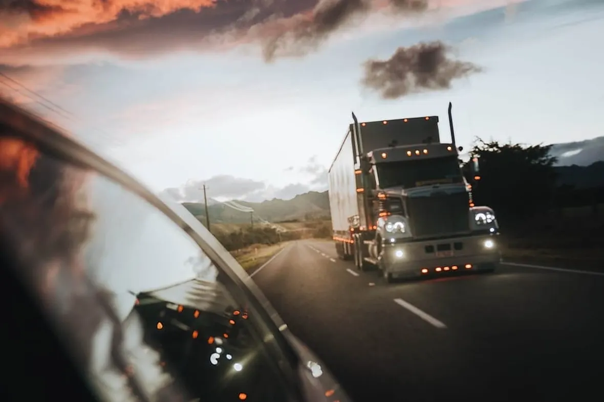 An HGV driver's cab, tachograph records are the single most-inspected paperwork in UK road transport.
