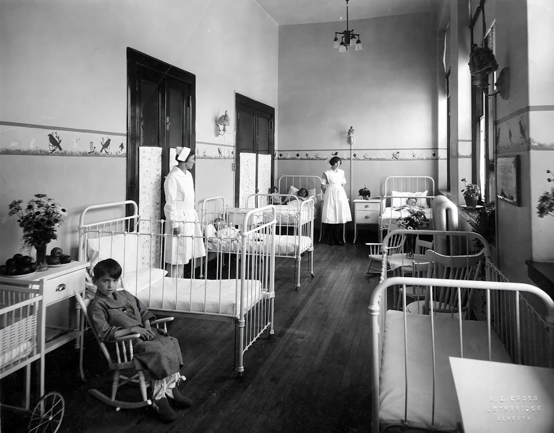A UK nurse on ward — NMC revalidation requires 450 practice hours and 35 hours of CPD every three years.