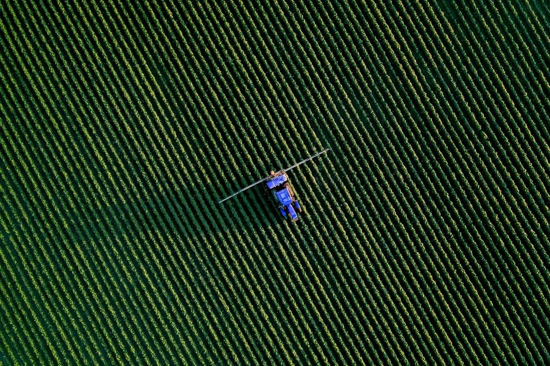 A UK farm crop sprayer — every professional pesticide application must be recorded with product, dose, date and operator.