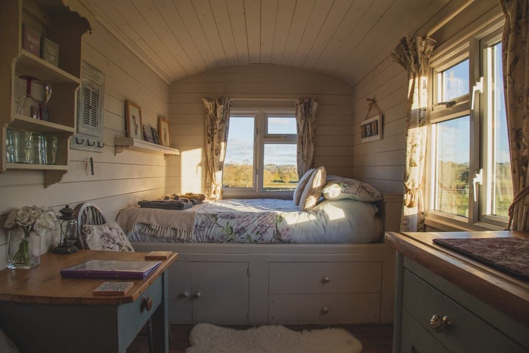 A UK caravan interior — annual habitation servicing checks gas, electrics, damp and bodywork, recorded in the service log.