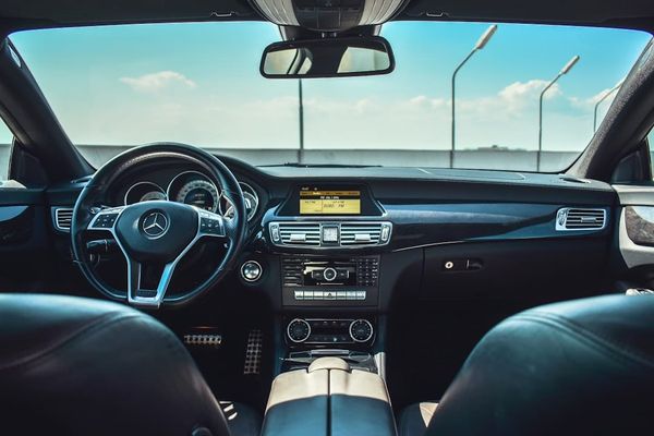 A UK car dashboard — digital service history portals make manufacturer-held records accessible to owners and buyers.