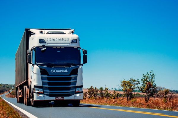 A UK driver's log book — modern digital tachograph cards have largely replaced paper records, but some operators still use both.