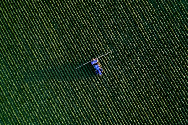 A UK farm crop sprayer — every professional pesticide application must be recorded with product, dose, date and operator.