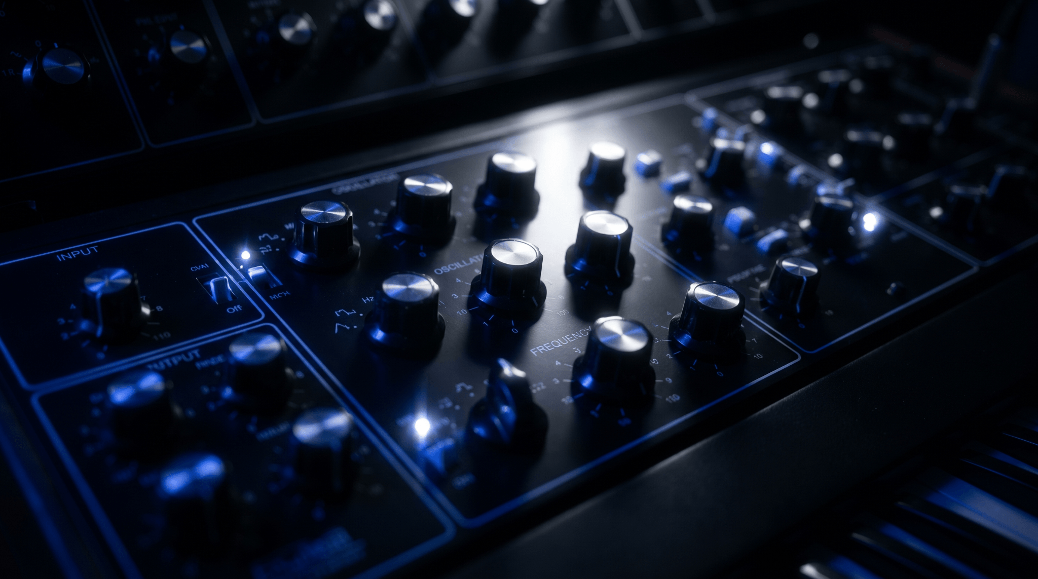 Close-up of an analog subtractive synthesizer with oscillator, frequency, filter, and modulation control knobs