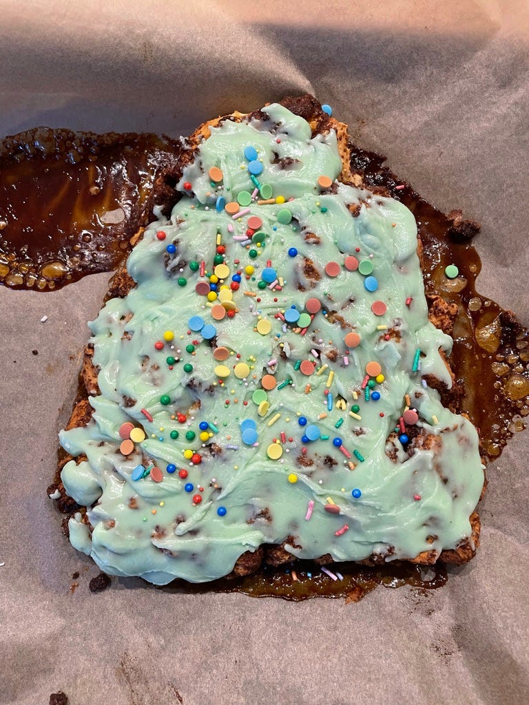 Yes, underneath this Christmas tree shape of icing and sprinkles (and above all of the leaky cinnamon filling) there are cinnamon rolls. 