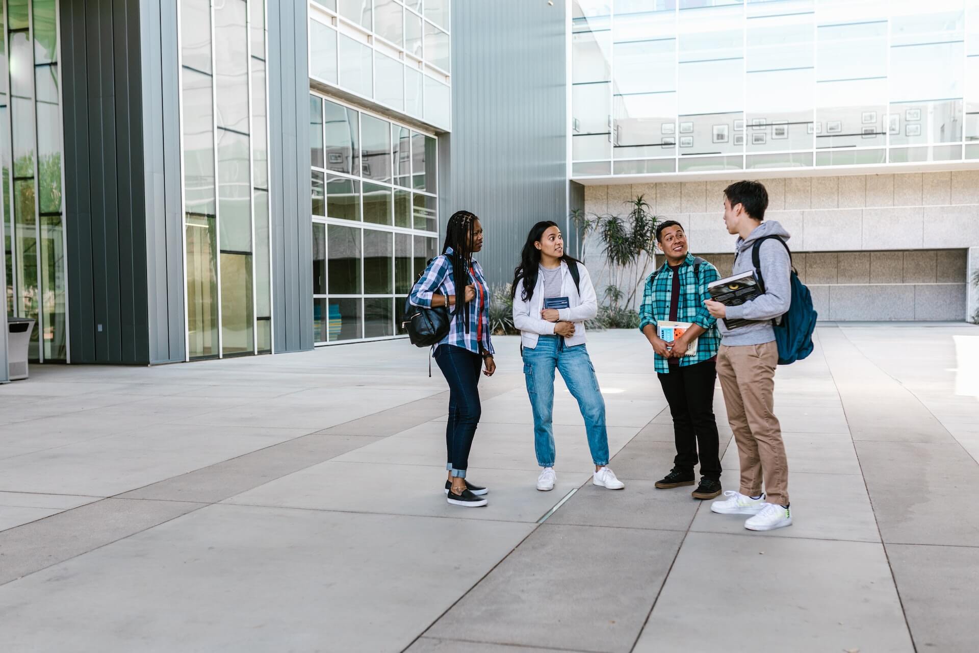 Group of college students standing outside of their class building