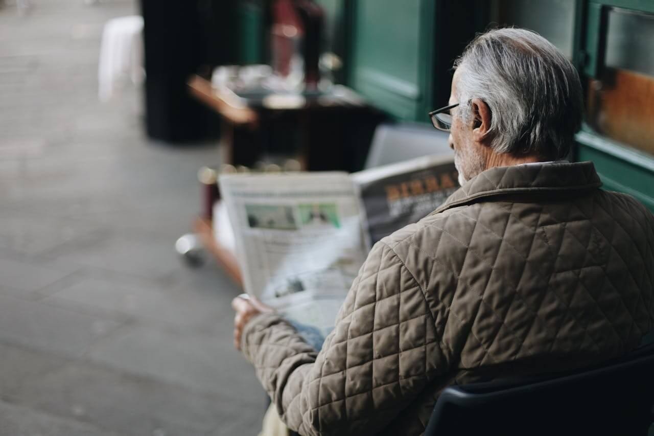 journalism school in america a man reading a paper