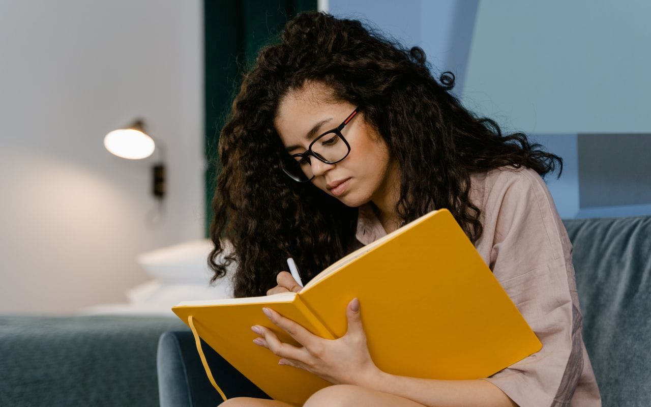 journalist writing in notebook