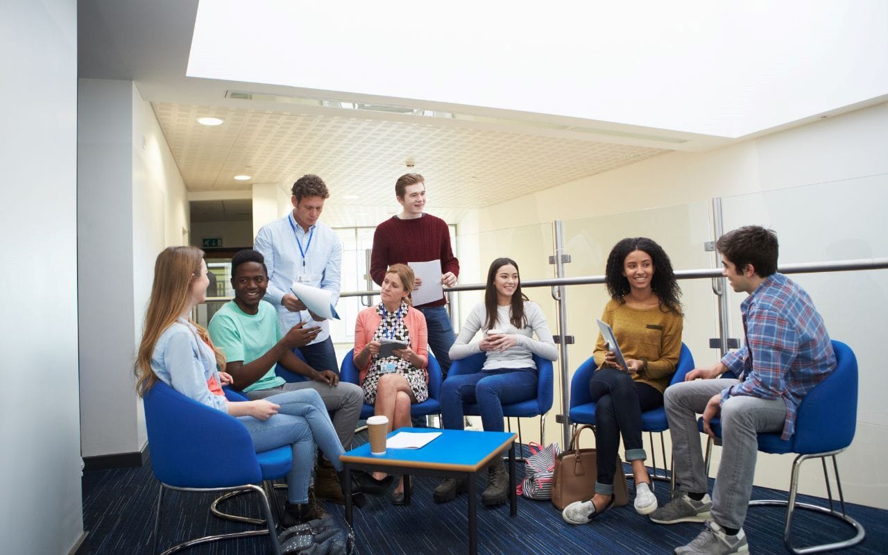 bachelor's degree vs trade school program students meeting
