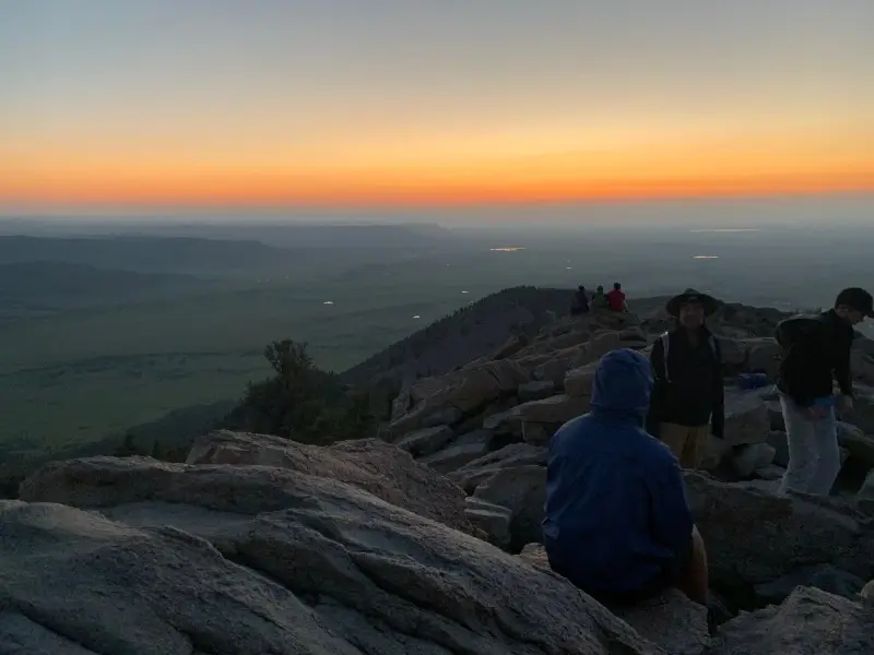 students enjoy the sunset in Arizona after a hike