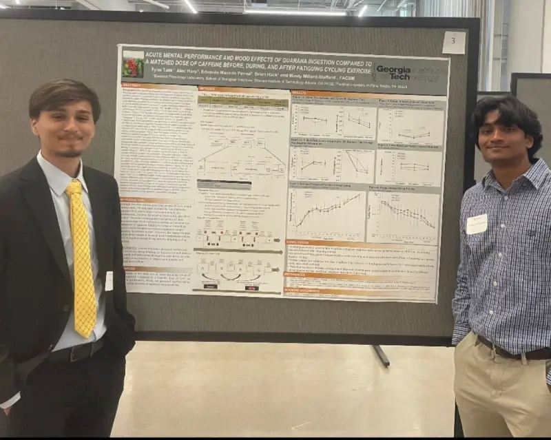 two students present their findings at a school event