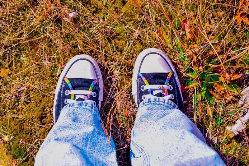 studnet's sneakers in the grass