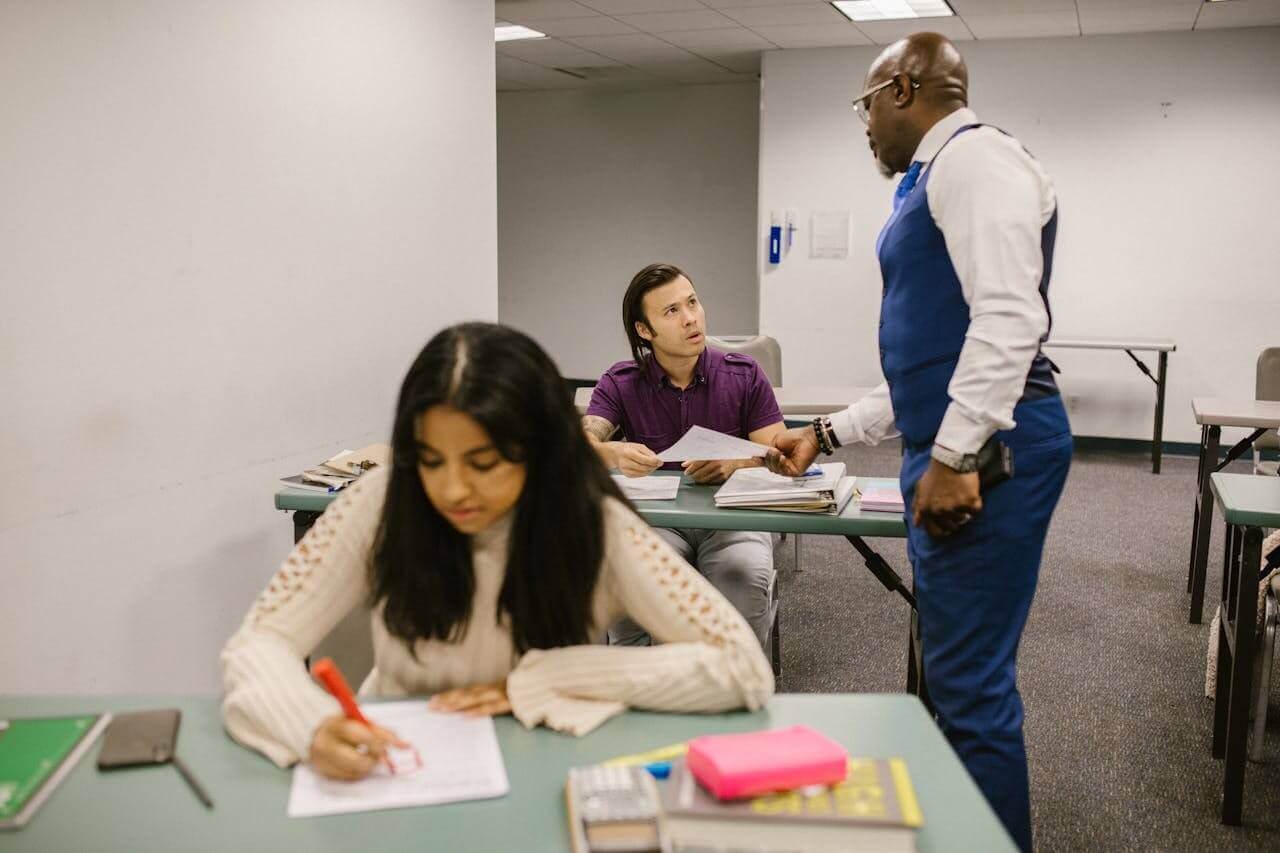 professor hands back final exam grades