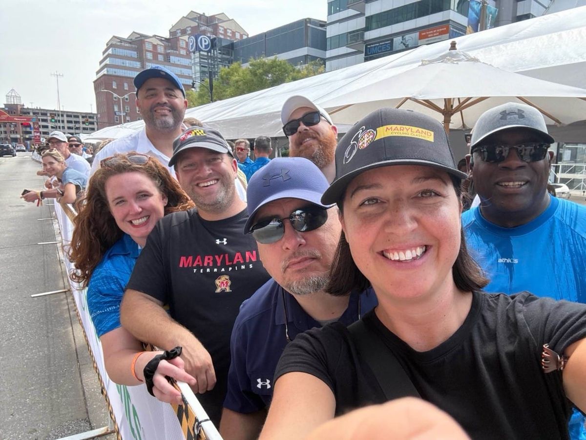Terry Hasseltine takes in the 2025 Maryland Cycling Classic with colleagues and friends Camille Spilker, Kevin Smith, Kris Smith, Eric Teisch, Ashley Harper Cottrell and Graham Whaples.