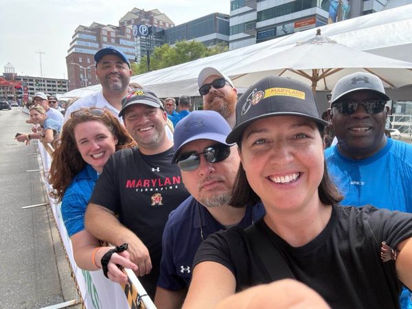 Terry Hasseltine takes in the 2025 Maryland Cycling Classic with colleagues and friends Camille Spilker, Kevin Smith, Kris Smith, Eric Teisch, Ashley Harper Cottrell and Graham Whaples.