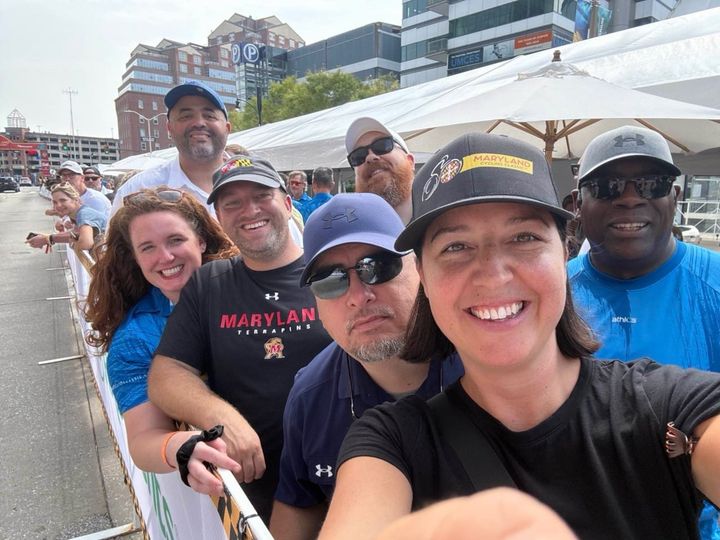 Terry Hasseltine takes in the 2025 Maryland Cycling Classic with colleagues and friends Camille Spilker, Kevin Smith, Kris Smith, Eric Teisch, Ashley Harper Cottrell and Graham Whaples.