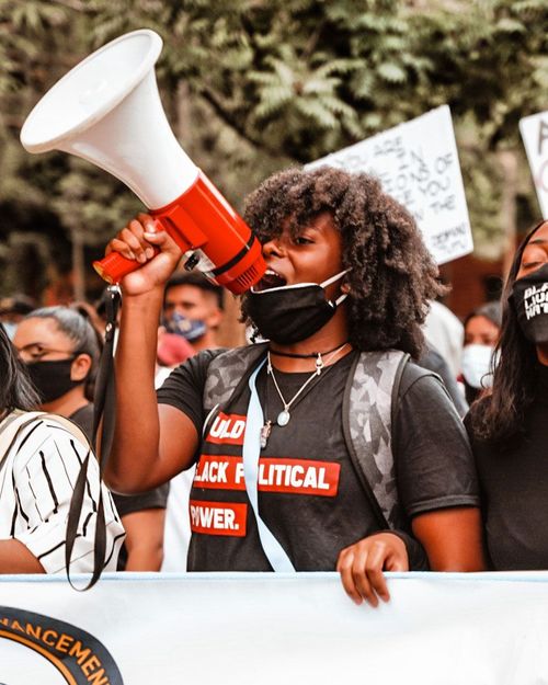 Person with megaphone at Black Lives Matter rally at Fresno City Hall